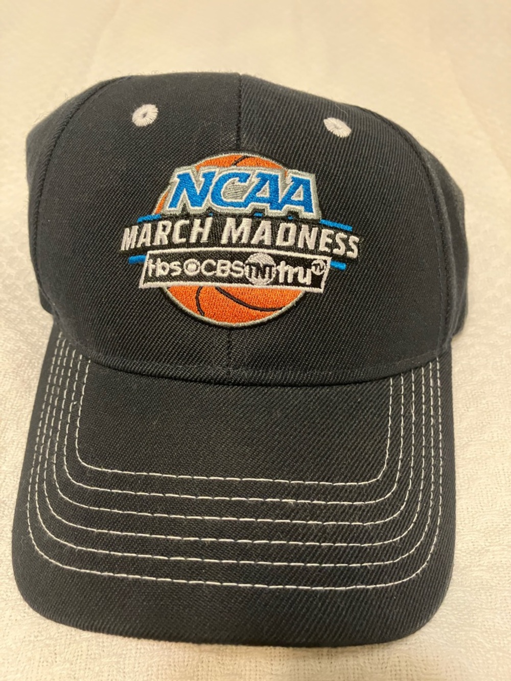 NCAA March Madness Black Cap with Orange Basketball Embroidery